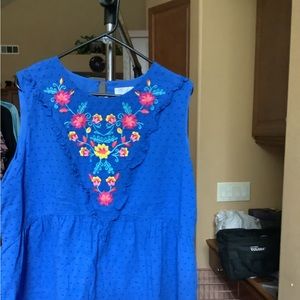 Beautiful blue sleeveless blouse with flowers